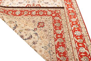 A semi-antique part silk Isfahan rug, a. 238 x 156 cm.