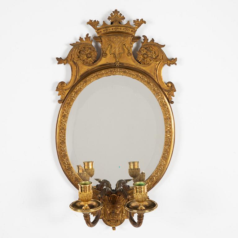 A pair of French Louis XIV-style ormolu two-light girandoles, after a model by Daniel Marot (1661-1752).