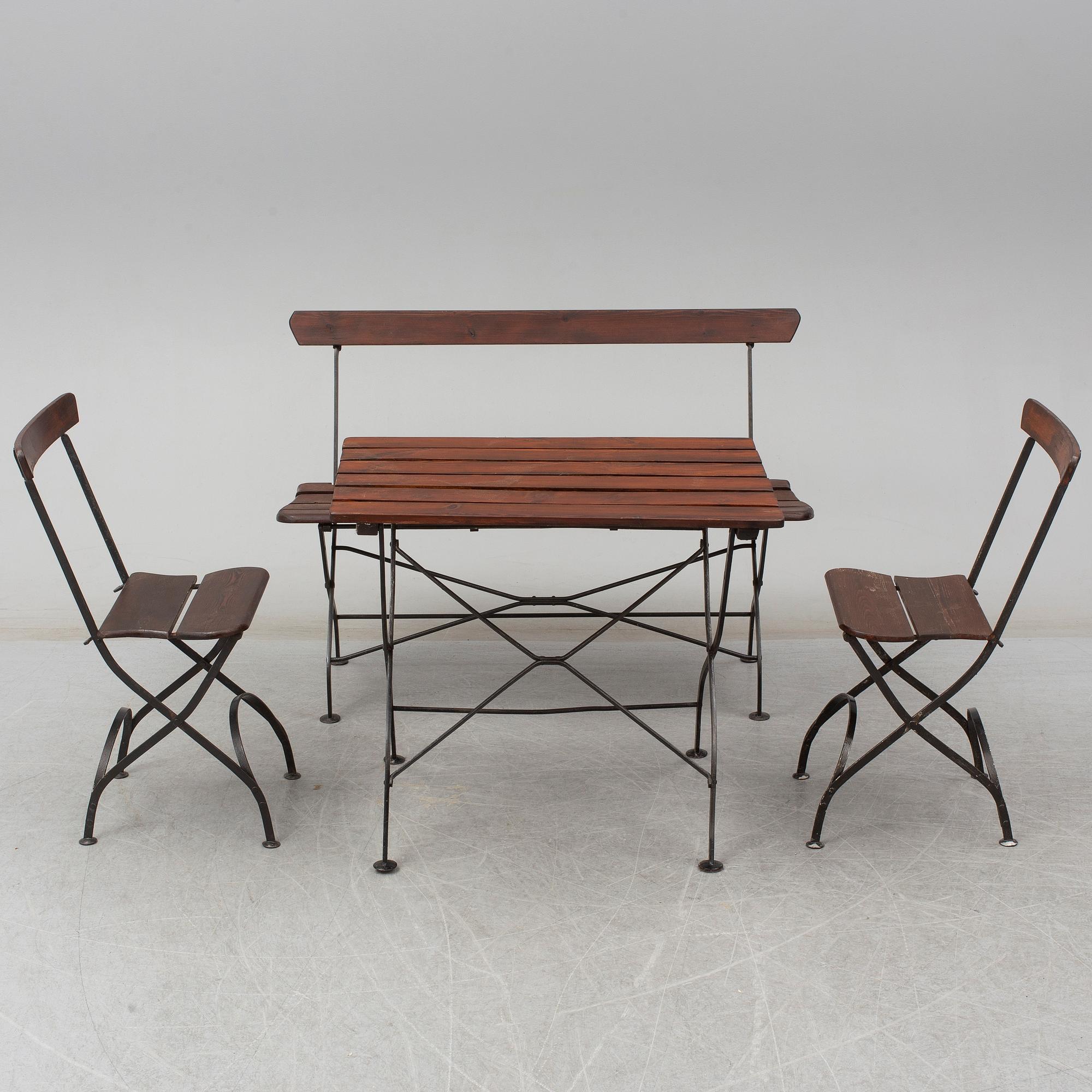 A garden sofa, table and a pair of chairs, first half of the 20th century.