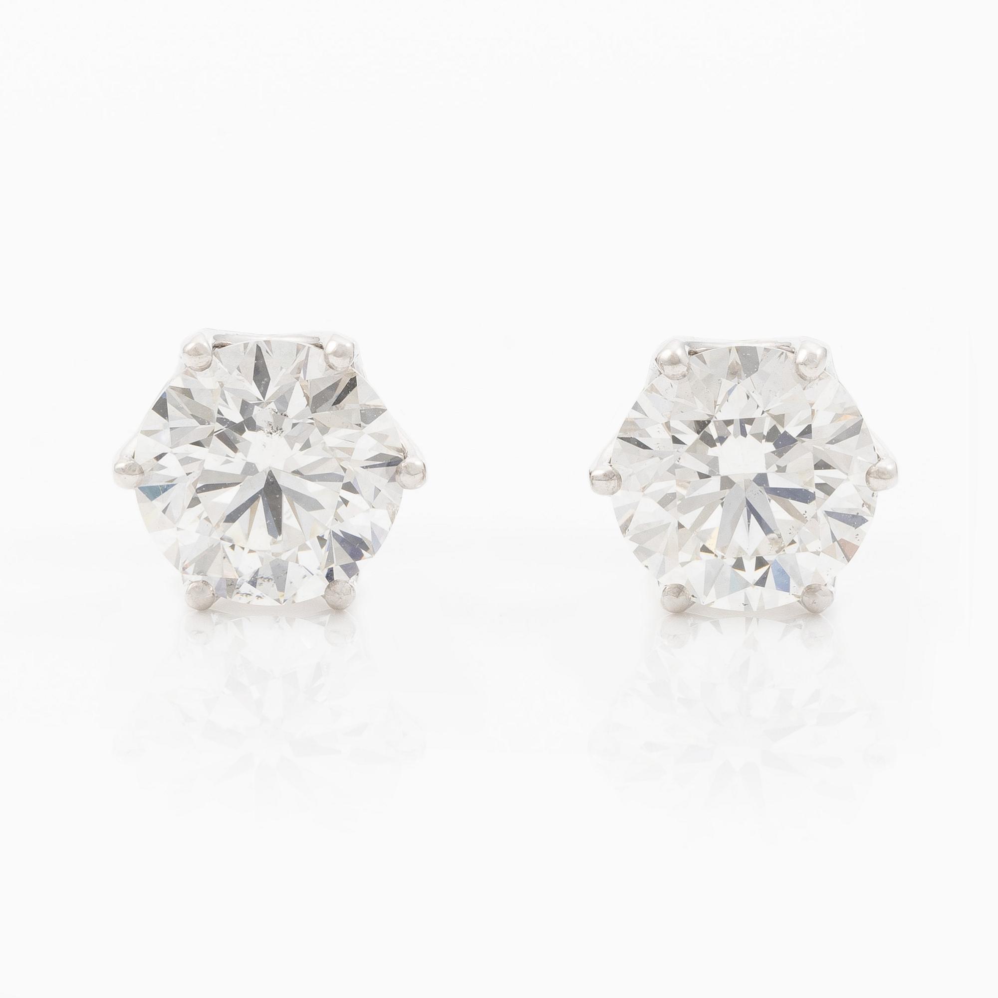 Earrings, single-stone earrings in 18K white gold with brilliant-cut diamonds, accompanied by IGI report.