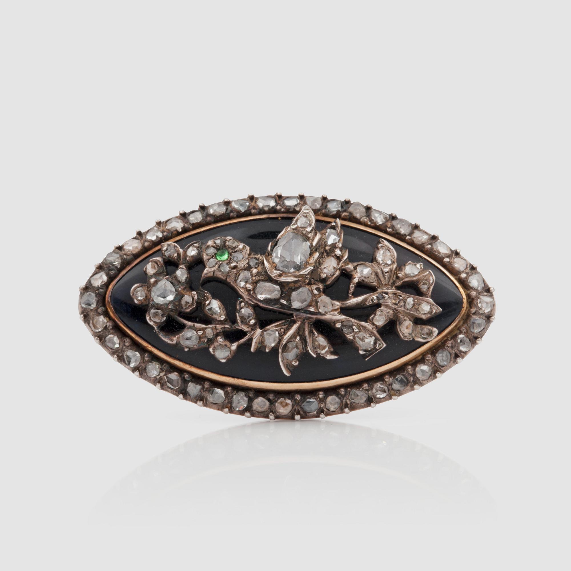 A late Victorian rose-cut diamond and dark blue enamel brooch.