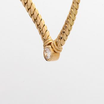Collier, 18K guld och en briljantslipad diamant.