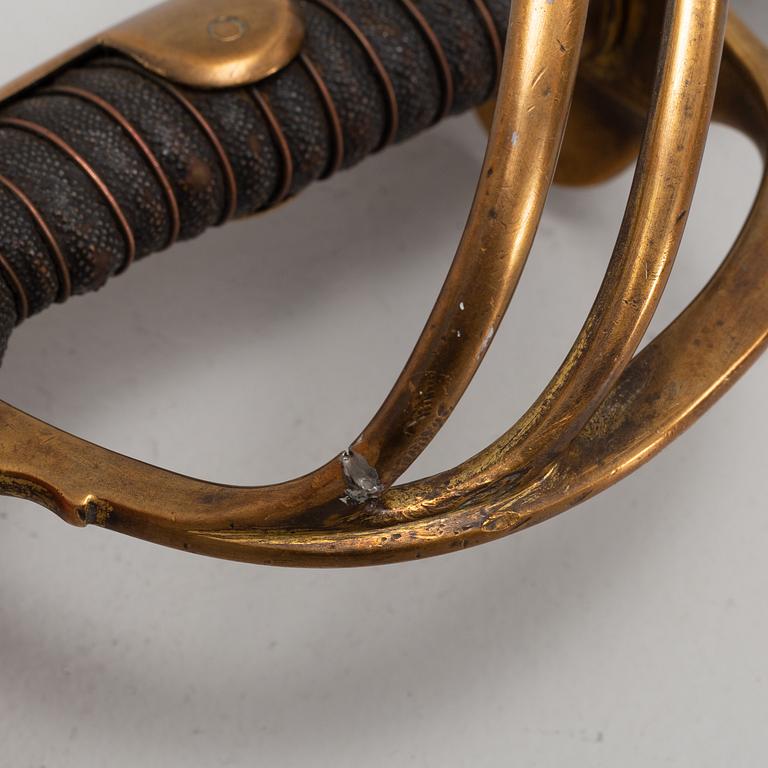 An 19th Century curved officer's sword with etched blade and steel scabbard.