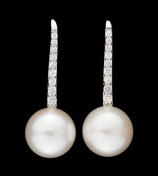 675. A pair of gold, cultured pearl and diamond earrings.