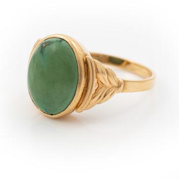 18K gold ring with green stone.
