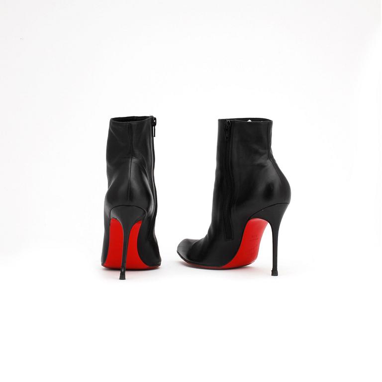 CHRISTIAN LOUBOUTIN, a pair of black leather boots. Size 37,5.
