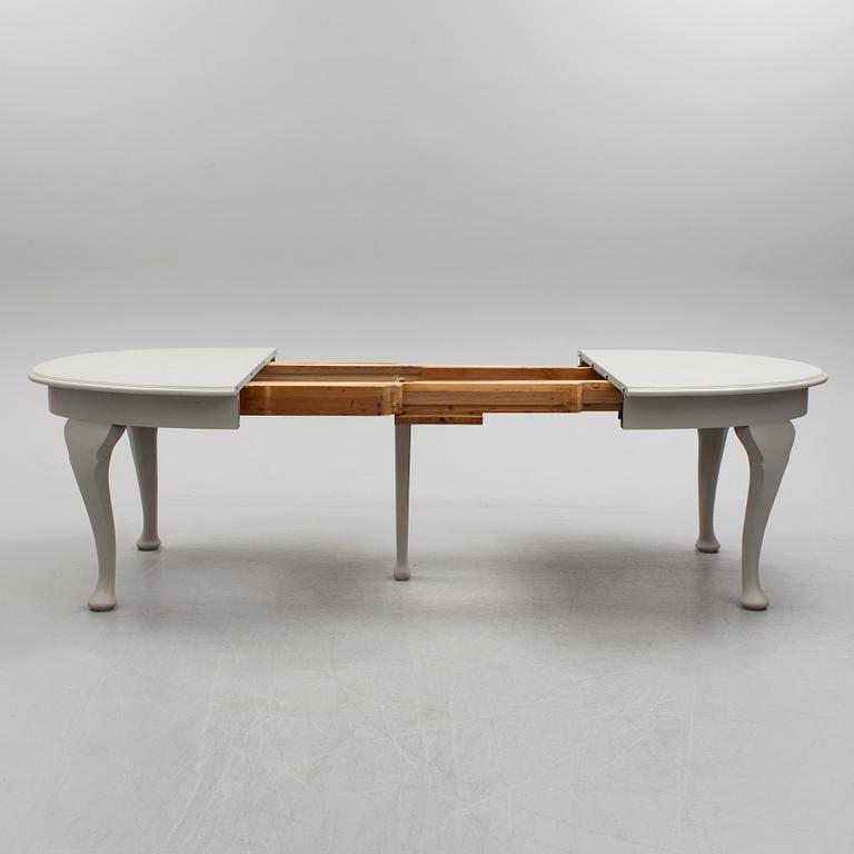 A painted Rococo style dining table, circa 1900.