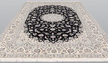 A Nain part silk carpet, 310 x 204 cm.