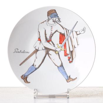 Piero Fornasetti, a set of 12 "Maschere Italiane" porcelain plates, Milan, Italy.