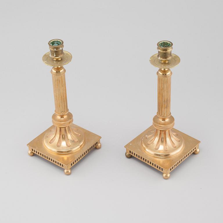 A pair of gustavian style brass candle sticks by Grillby Metal factory, Sweden, first half of the 20th century.