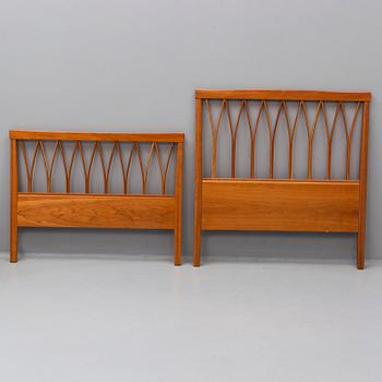 A Carl Malmsten head boards and bedside table, late 20th century.