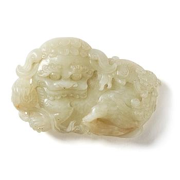 A jade belt buckle in the shape of a buddhist lion, Qing dynasty, 18th century.