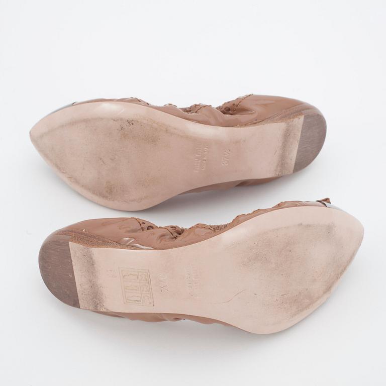 MIU MIU, a pair of leather ballet flats.