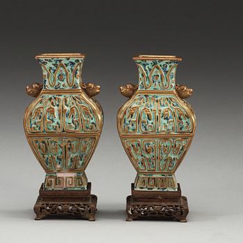 A pair of vases, late Qing dynasty, with Qianlong sealmark.