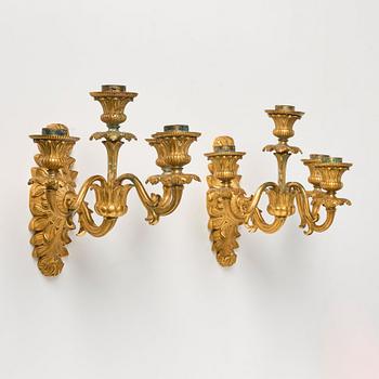 A pair of late Empire ormolu four-branch wall lights, circa 1840.