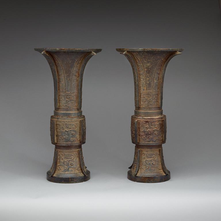 A pair of large archaistic shaped bronze Gu vases, Ming dynasty (1368-1644).