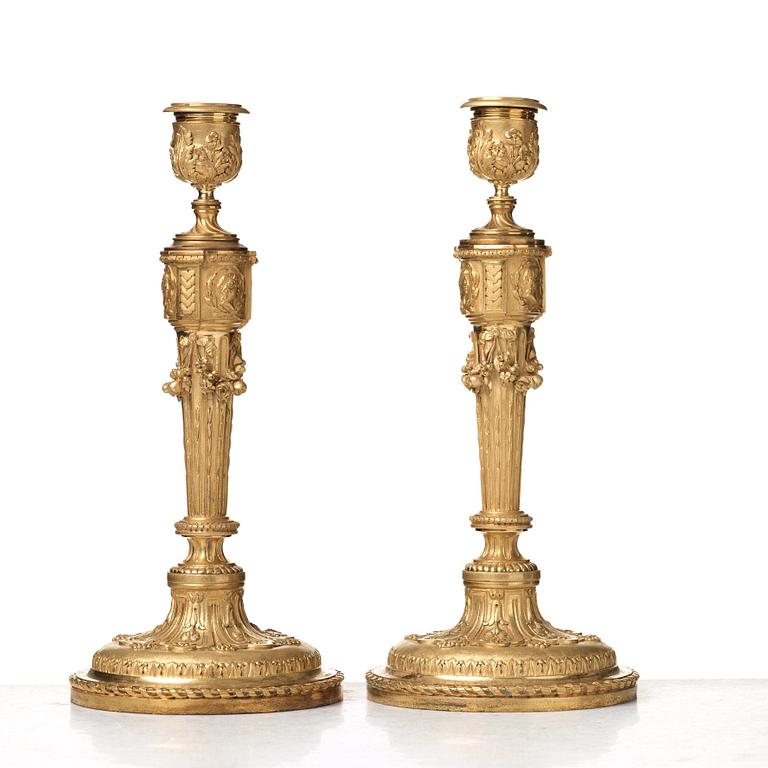 A pair of Louis XVI-style 19th century candlesticks by Raingo Frères, Paris.