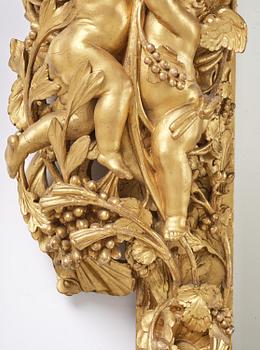 A presumably Dutch Louis XIV carved giltwood frame with mirror glass, in the style of Jean Le Pautre, late 17th century.