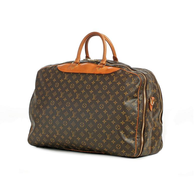 LOUIS VUITTON, a monogram canvas bag / garment cover.