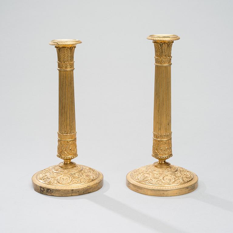 A PAIR OF CANDLESTICKS, gilt bronze, empire early 19th century.