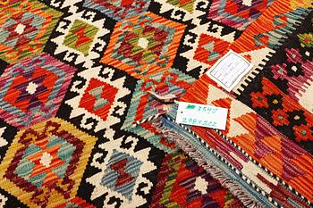 An Afghan Kilim carpet, c. 298 x 202 cm.