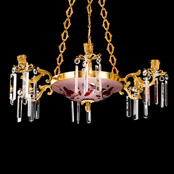 A brass and cut glass chandelier from the latter half of the 19th Century.