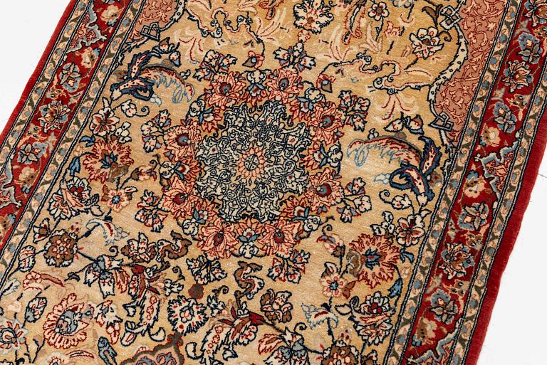 A semi-antique Isfahan rug, central Iran, part silk, signed (Mohammed) Seirafian, c. 120 x 70 cm.