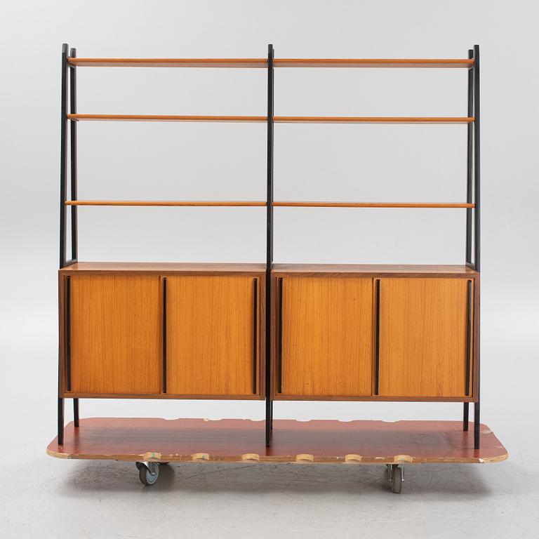 Teak veneered book cases with cabinets.
