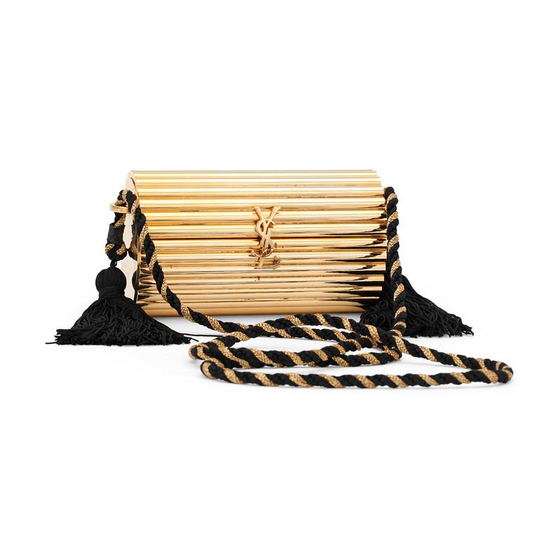 YVES SAINT LAURENT, a golden metal evening bag.