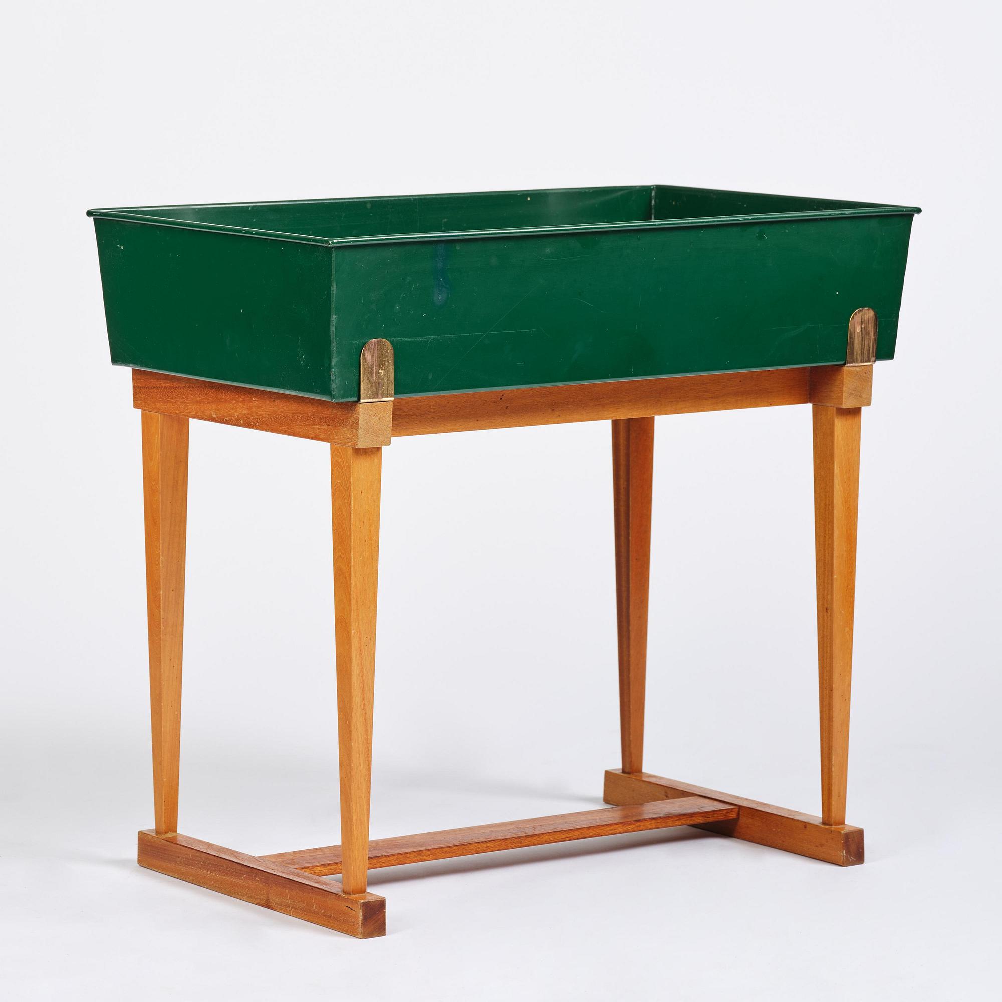 Josef Frank, a rare flower table with green lacquered box model B 2084, Firma Svenskt Tenn, 1950-60s.