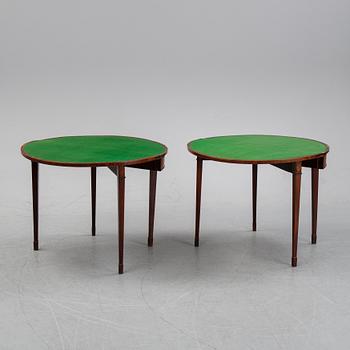 A pair of George III demi-lune mahogany card tables, first half of the 19th Century.