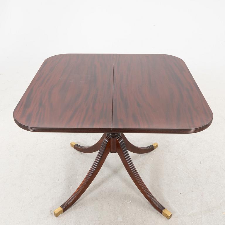 AN English mahogany dining table later part of the 20th century.