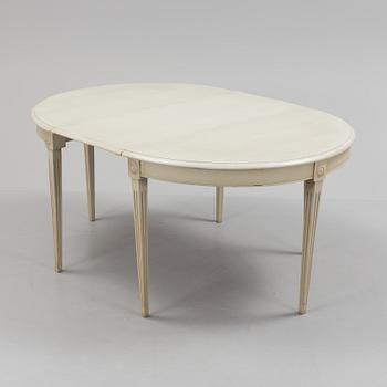 A lot of four mid 20th century Swedish Gustavian style chairs and one dinner table from around year 1900.