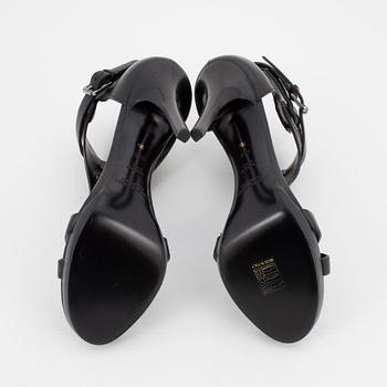 RALPH LAUREN, a pair of black leather sandals. Size US 8 1/2.