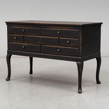 A rococo-style chest of drawers from the first half of the 20th century.