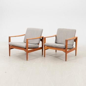 A pair of teak easy chairs, Denmark middle fo the 20th century.