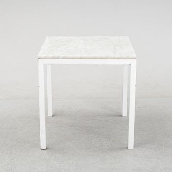 A marble top table, 21th century.