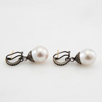 Earrings, a pair of oxidised silver with diamonds and cultured drop-shaped pearls.