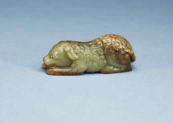 1286. A carved nefrite figure of a reclining dog, Qing dynasty.