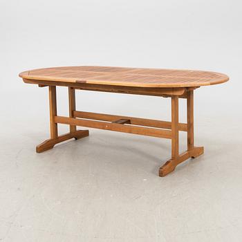 A 9 pcs stained teak garden suite by Brafab around 2000.