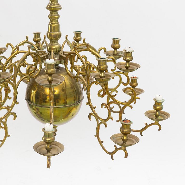 A baroque-style eighteen-branch brass chandelier, late 19th century.