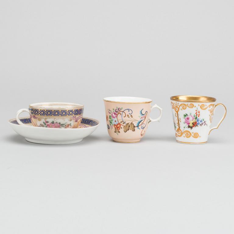 A Russian 19th century Popoff porcelain cup with saucer and two cups.