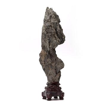 A Chinese scholars rock with a wooden stand, 20th Century.