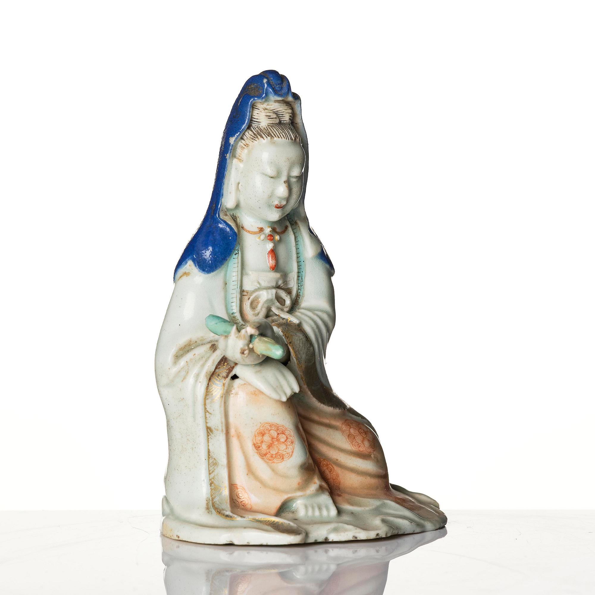 A porcelain figure of Guanyin, Qing dynasty, (1736-95).
