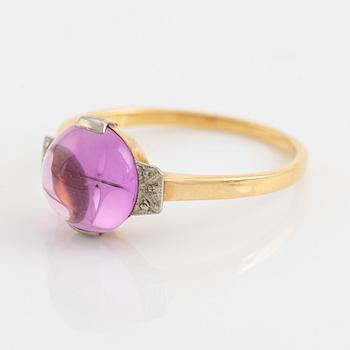 18K gold and cabochon cut syntehtic pink sapphire.