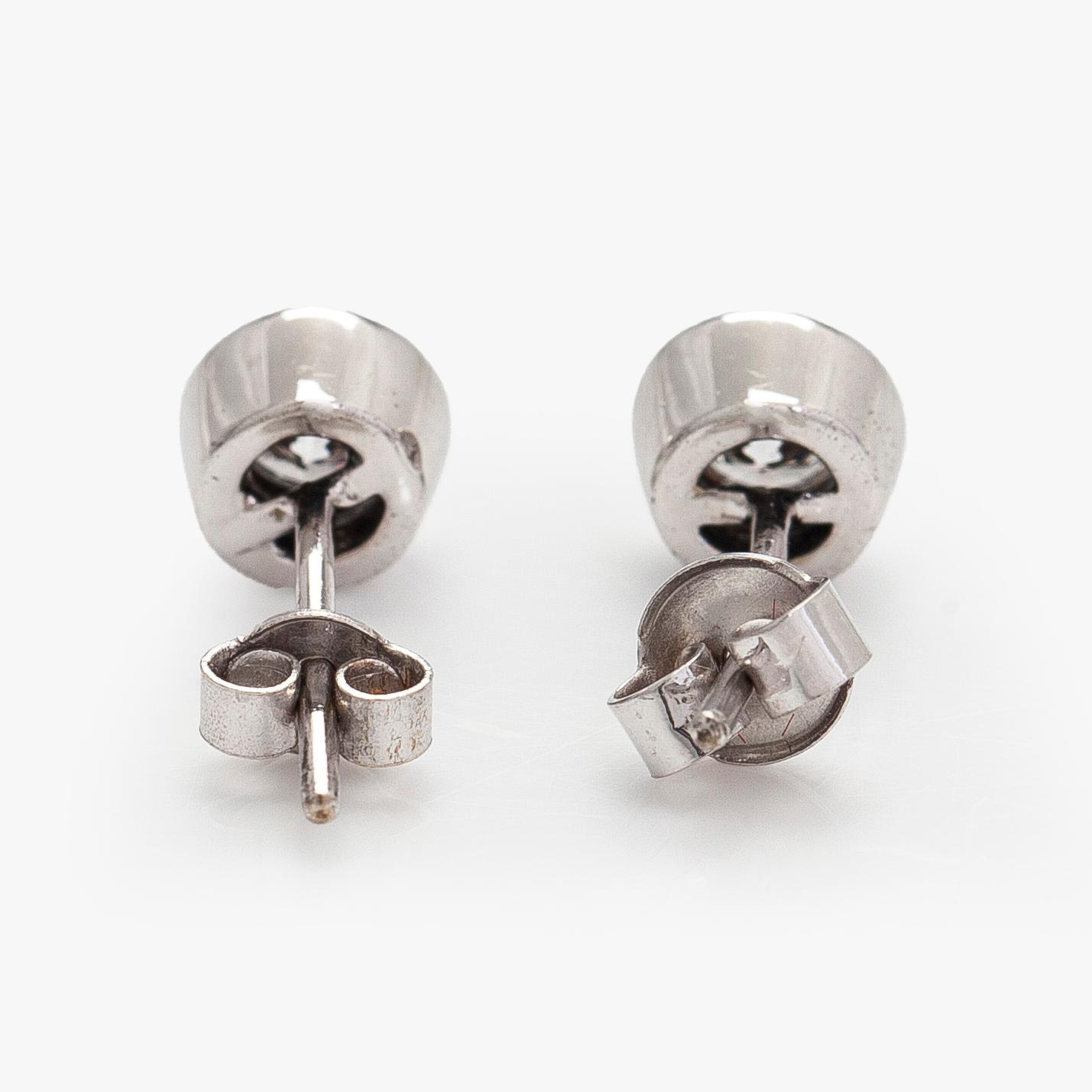 Earrings, brilliant-cut diamonds totalling circa 0.60 ct, 14K white gold.