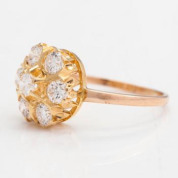 A 14K and 18K gold and diamond cluster ring ca 1.15 ct in total.