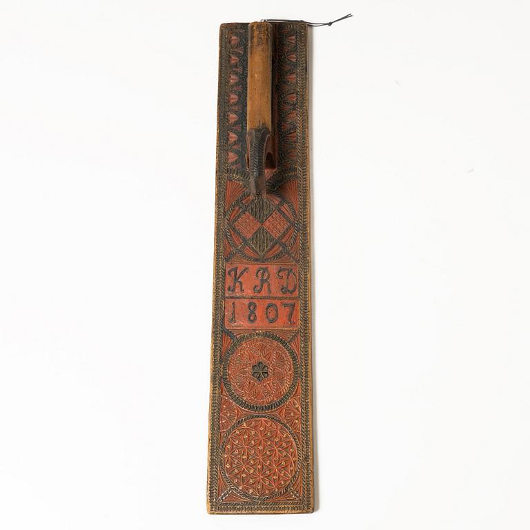 A painted wooden mangle board, Southern Sweden, dated 1807.