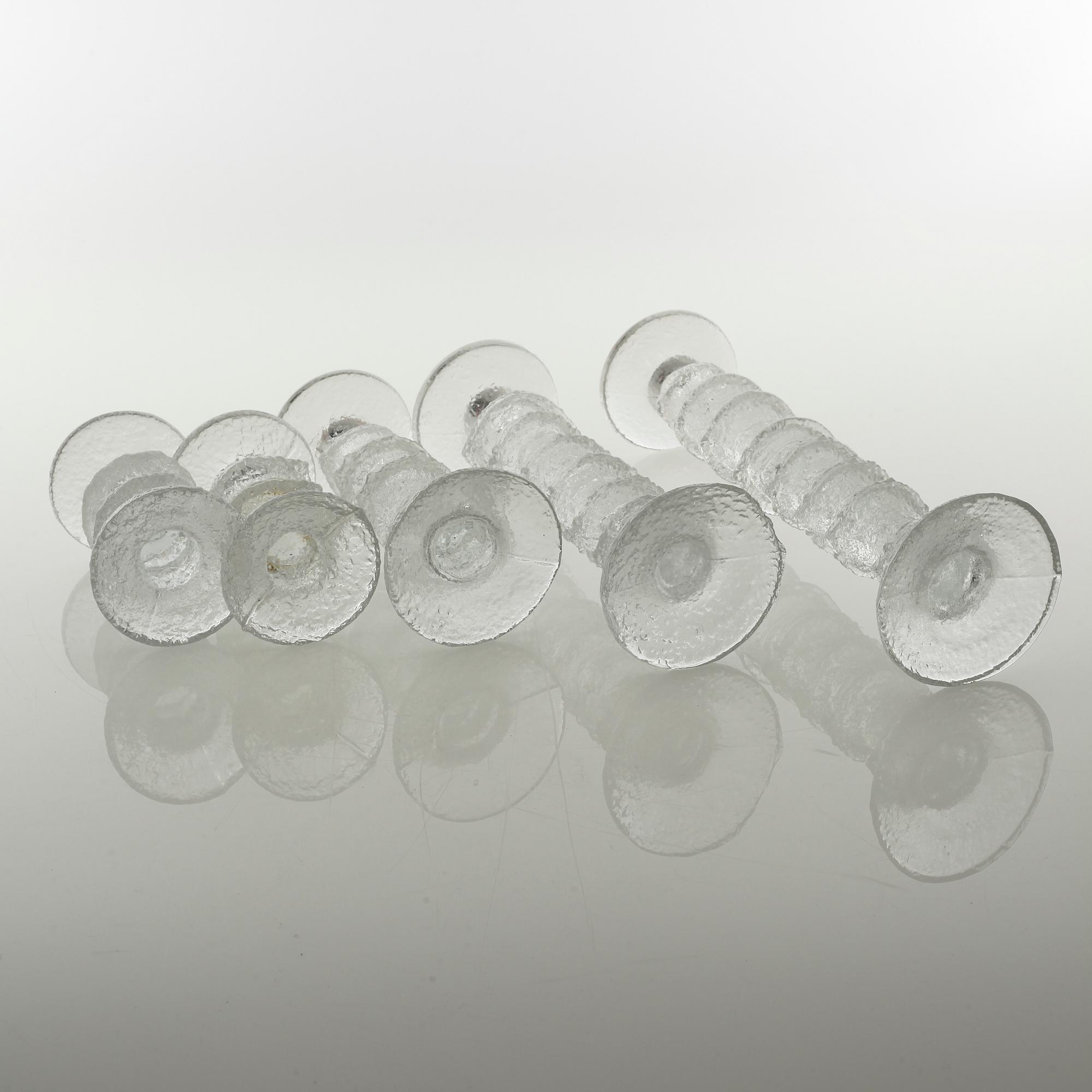 Five glass candlesticks by Timo Sarpaneva for Iittala, model "Festivo", second half of the 20th century.