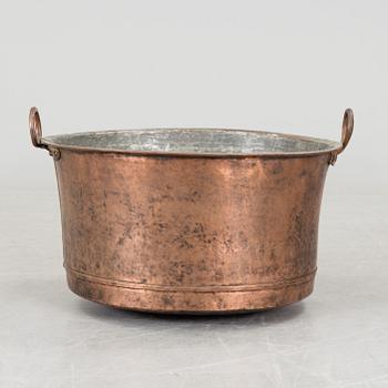 A 19th century copper cauldron.